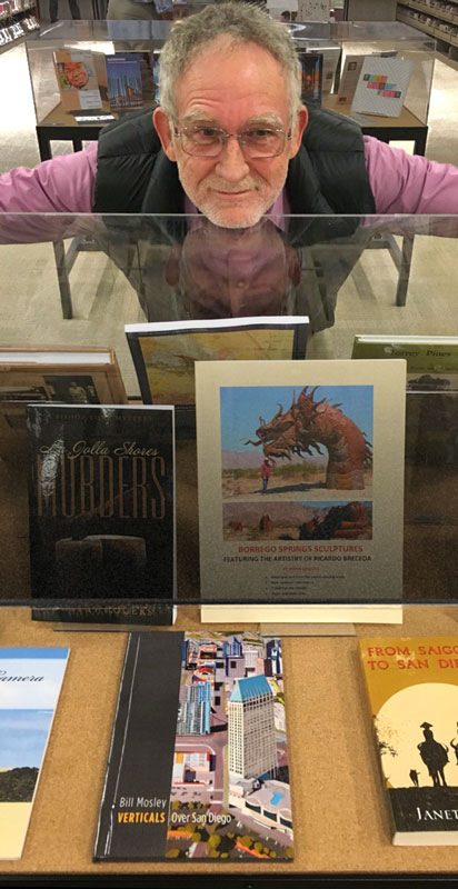 Bill Mosley with his book in a display at the San Diego Museum of Art.